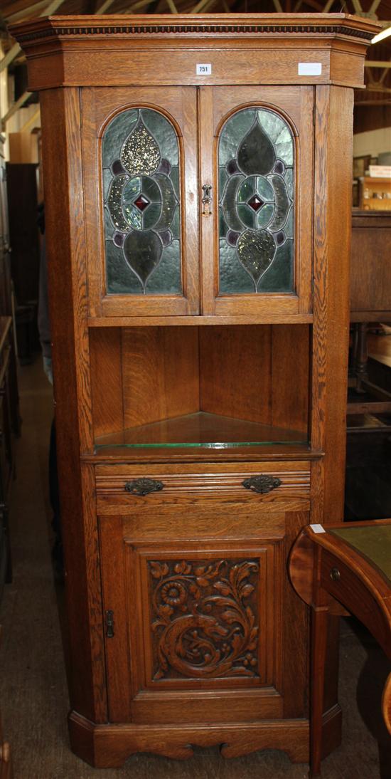 Carved oak standing corner cupboard